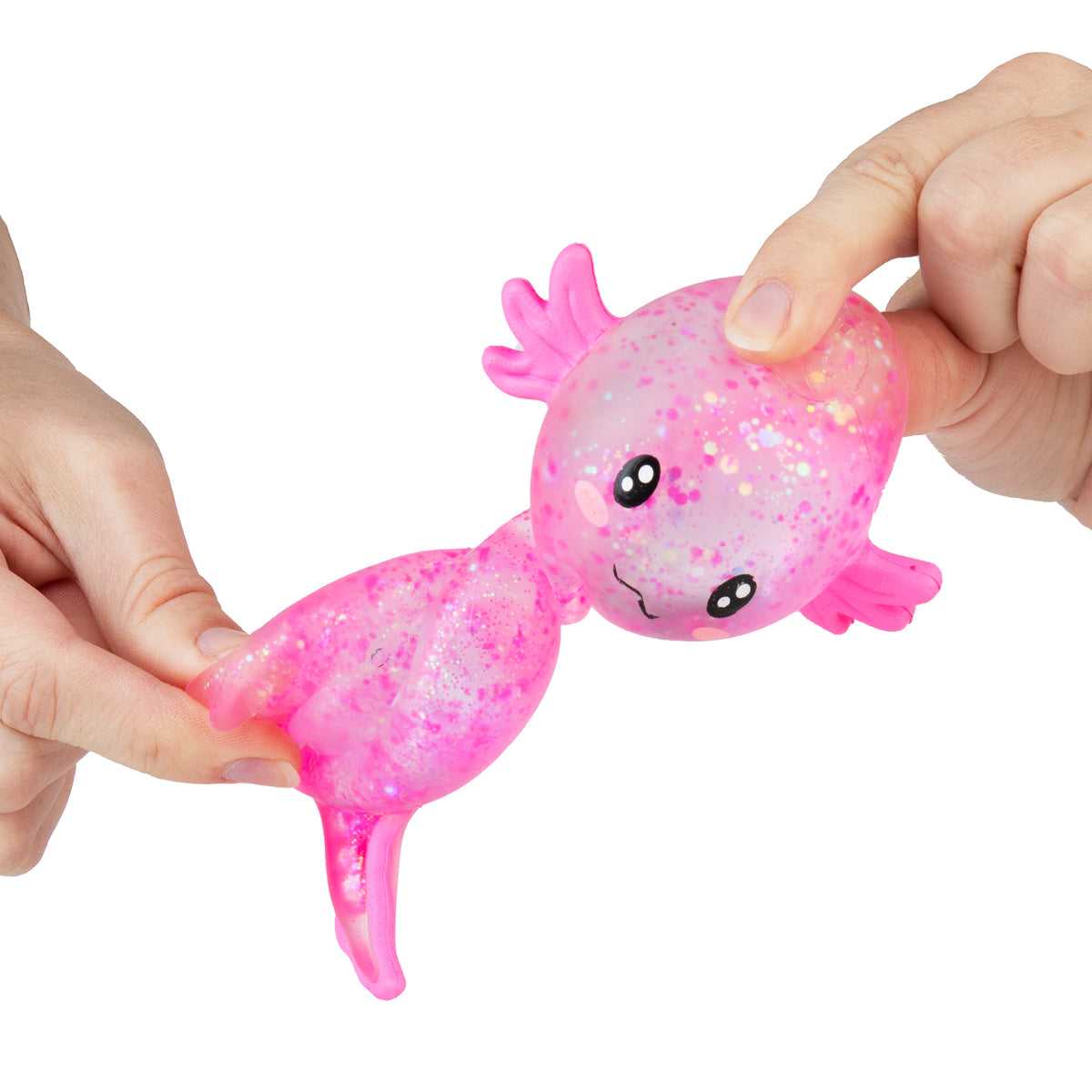 Two hands stretching a pink glitter Sugar Swaps axolotl squishy to show its soft, stretchy body