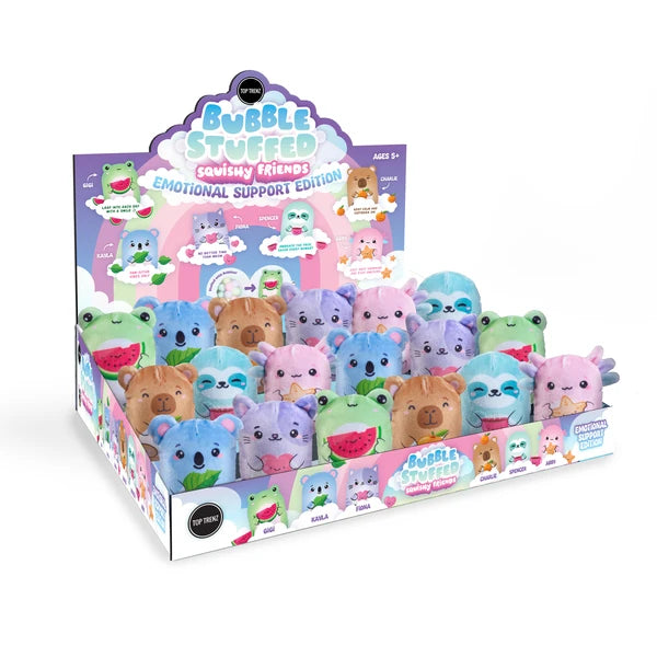 A retail display box filled with colorful bubble-stuffed animal toys from Bubble Stuffed's 'Squishy Friends Emotional Support Edition'. The display features a variety of plush animals including koalas, bears, frogs, and turtles in pastel colors, with a branded cardboard backing.