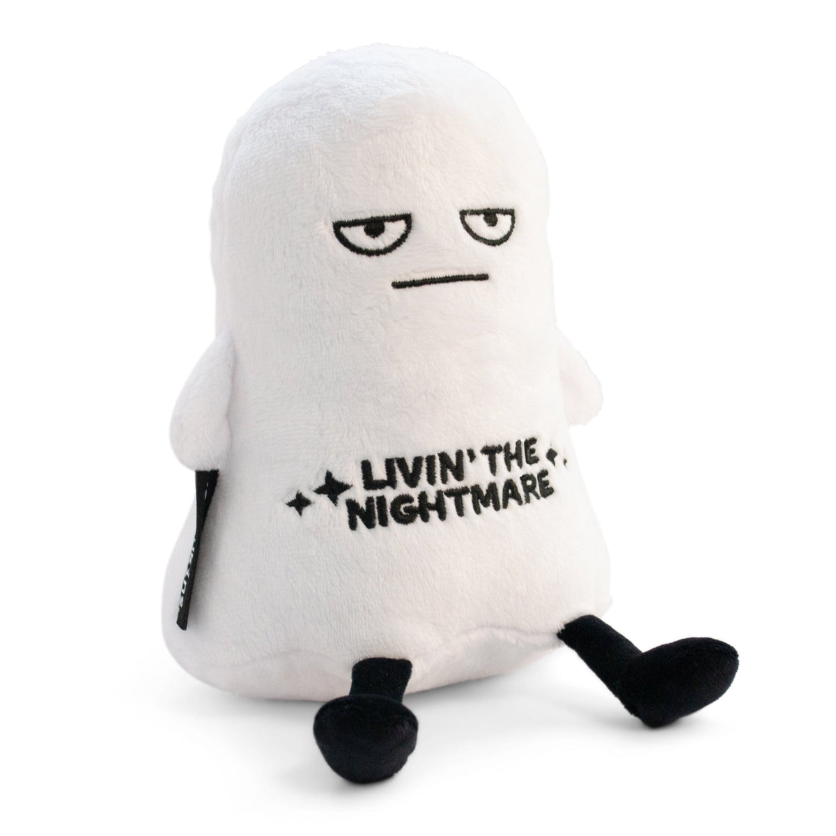 White Punchkins ghost plush with a grumpy half-lidded face, black dangly legs and “Livin’ the Nightmare” embroidered on its chest