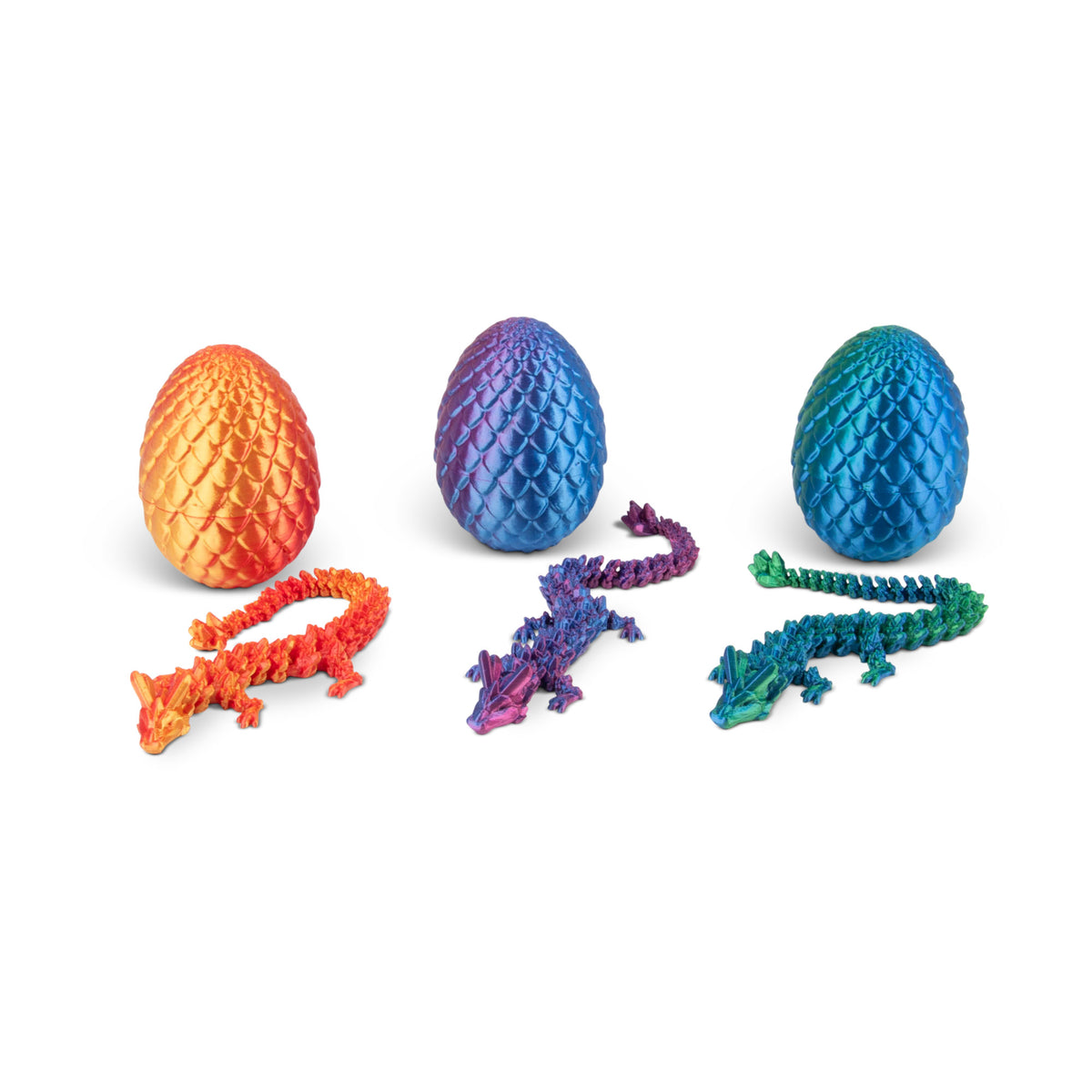 Three assorted-color dragon eggs open in a row showing dragon figures inside each