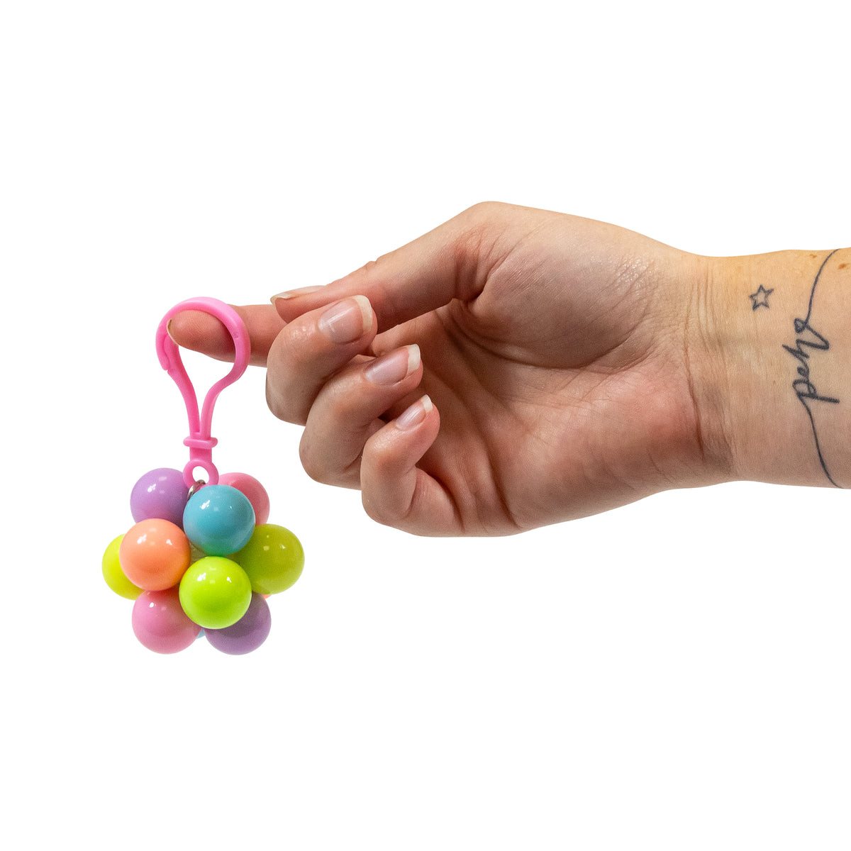 Open display box full of Atomic Fidget Ball Keychains in assorted colors