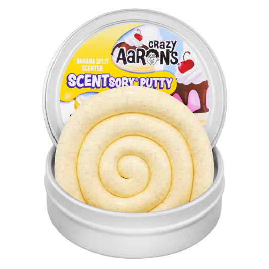 Open tin of Crazy Aaron's Banana Split SCENTsory Thinking Putty showing creamy yellow scented putty with colorful speckles.
