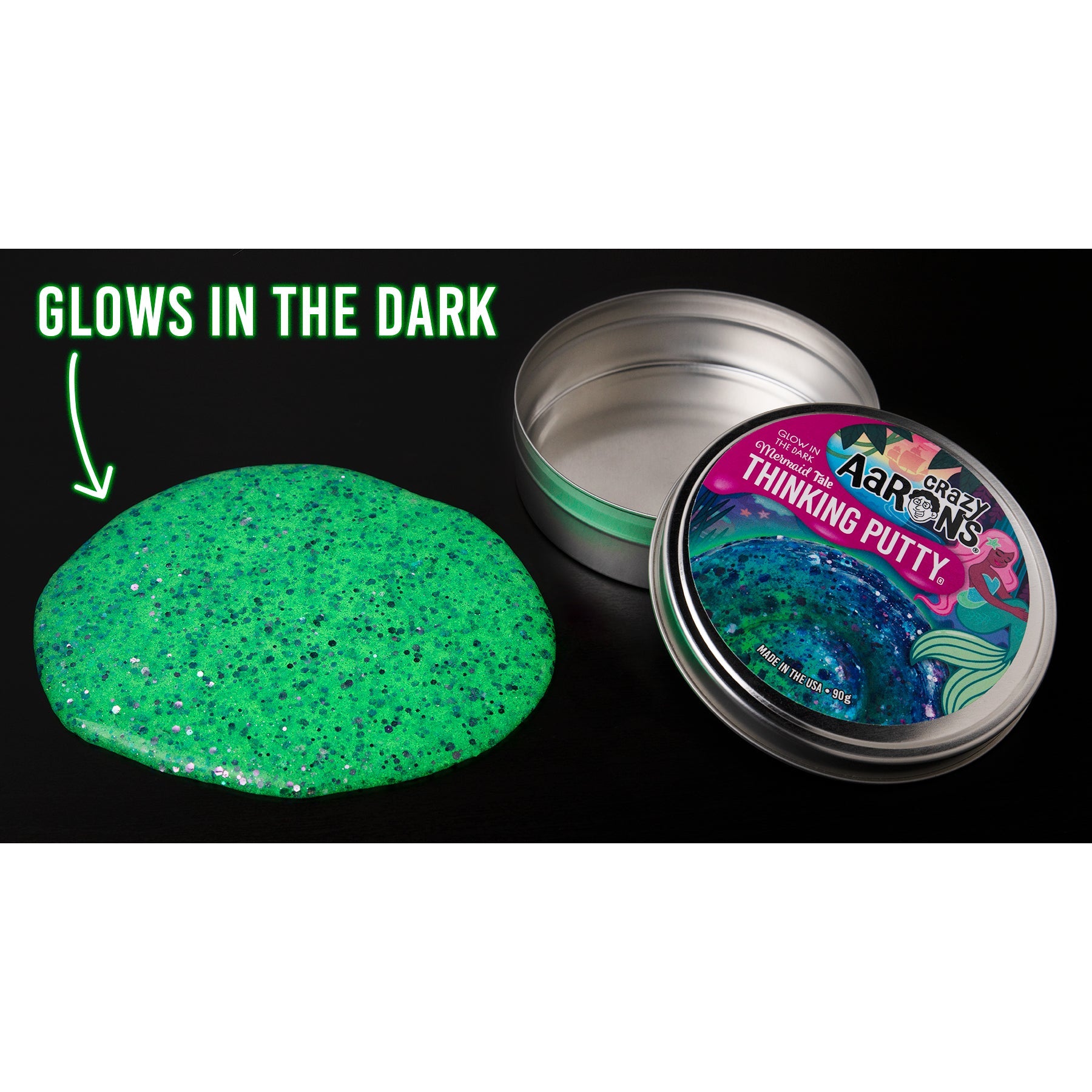 Mermaid Tale Glowbrights Thinking Putty glowing sea green in the dark beside its storage tin.