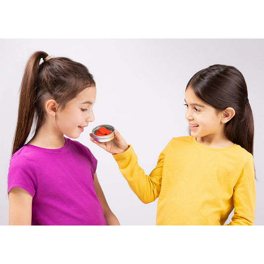 Child enjoying the sweet cherry-berry scent of Crazy Aaron's Swedish Sweets SCENTsory Thinking Putty.