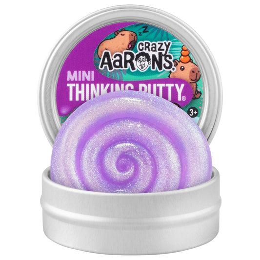 Open Crazy Aaron's Mini Capybara Thinking Putty tin displaying shimmering purple putty inside.