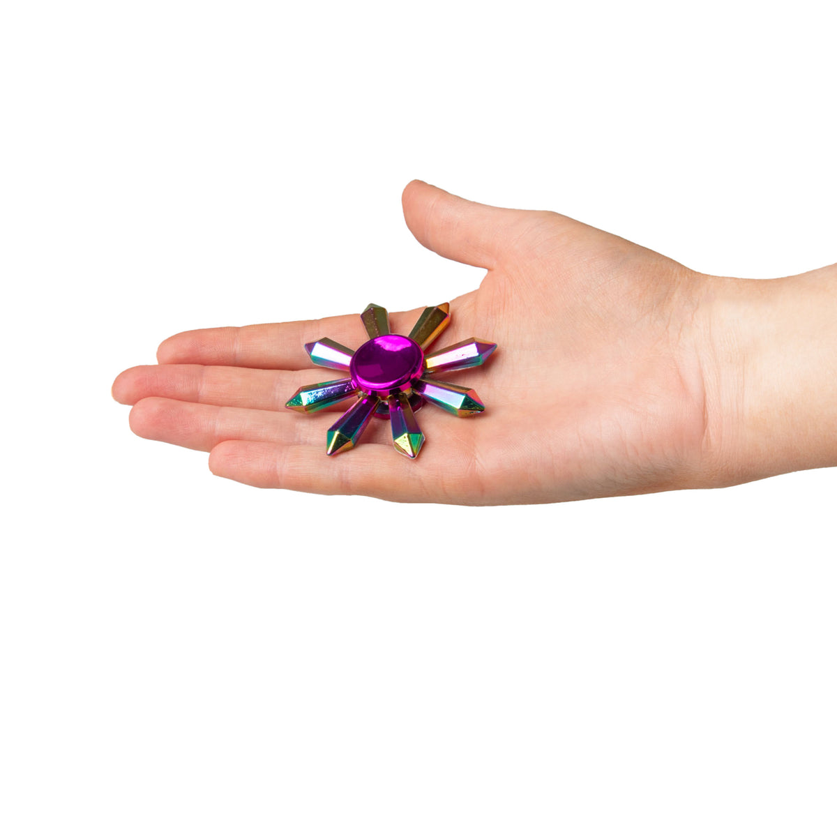FIDGIX rainbow fidget spinner resting in an open palm to show scale