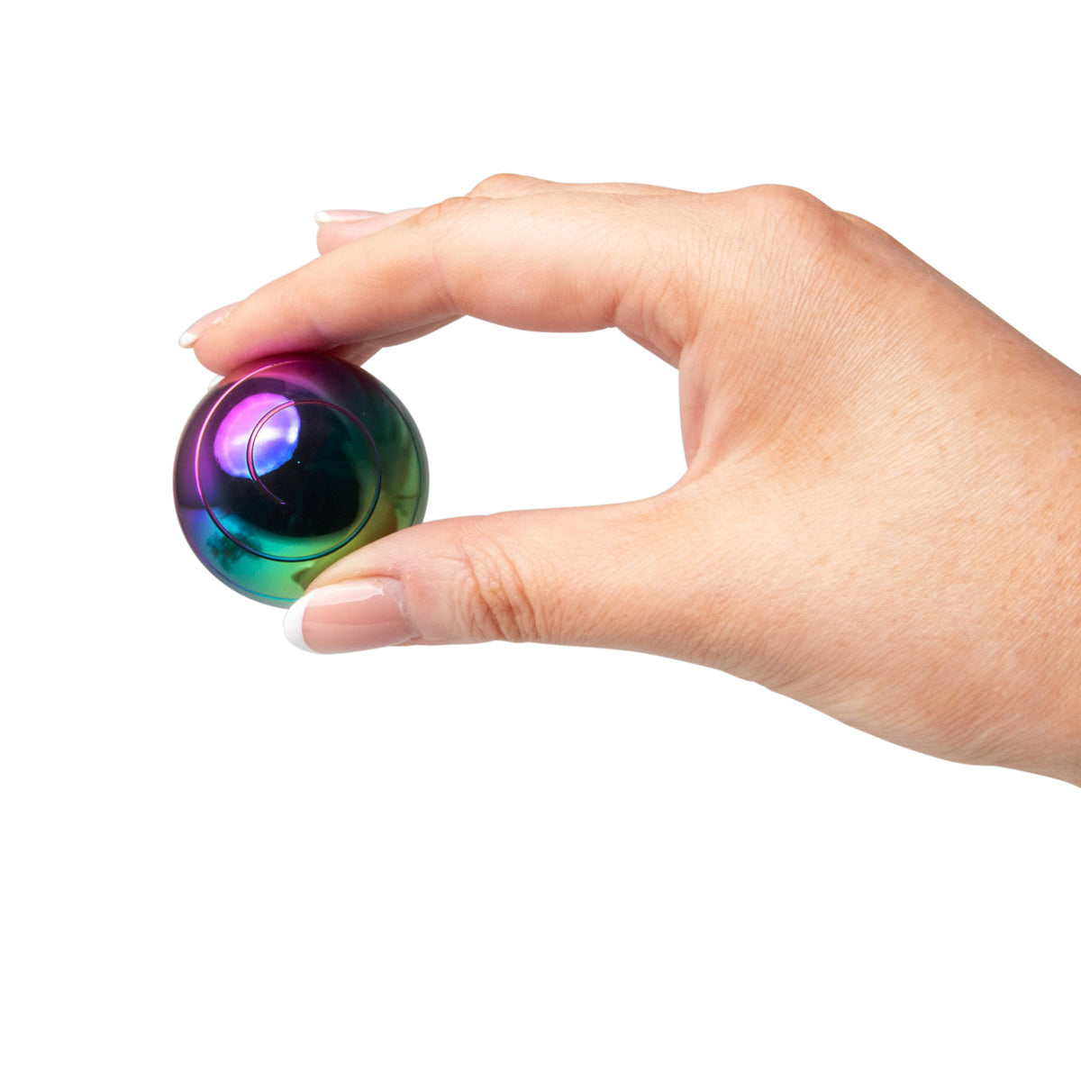 Fingers pinching the FIDGIX Spinning Sphere to show its compact size
