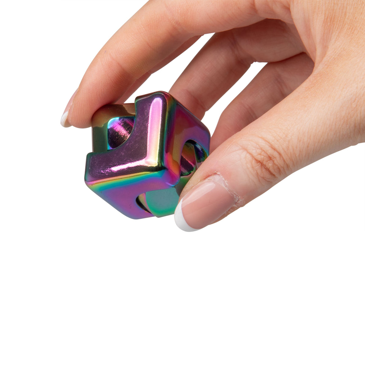 Hand pinching open the corner of a rainbow metal fidget cube