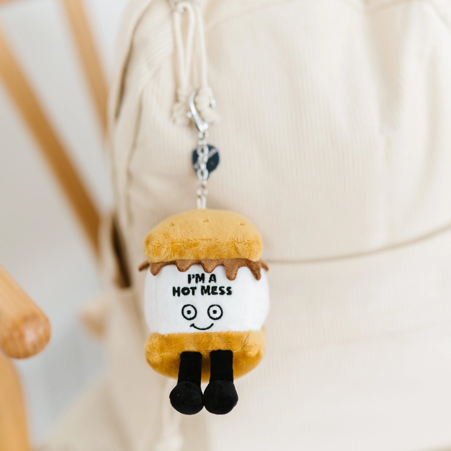 I’m A Hot Mess s’mores plush bag charm hanging on a bag as cute accessory