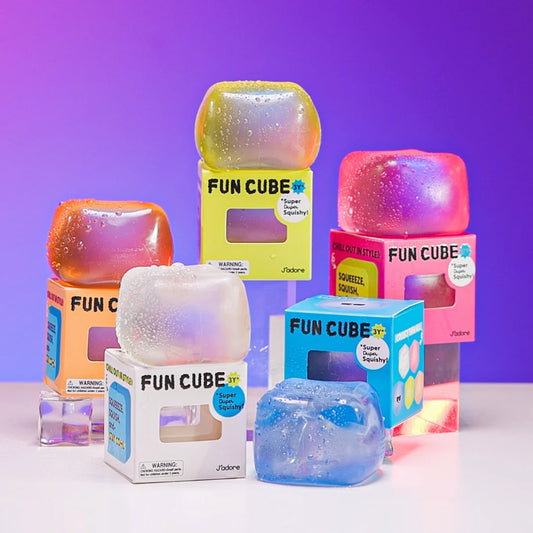 J'adore Fun Cube boxes and squishy cubes arranged together on a purple background