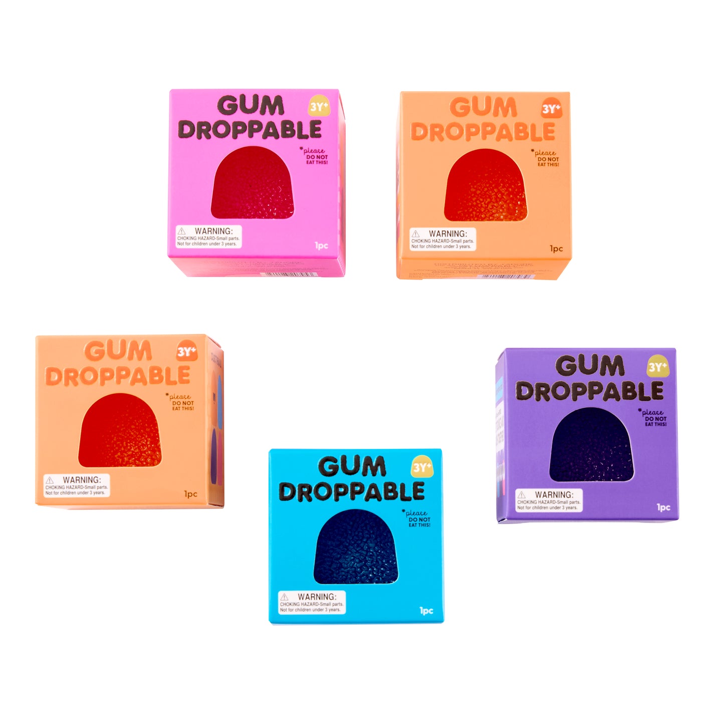 Assorted Gum Droppable Squish toy packaging in pink, orange, blue, and purple boxes by J'adore.