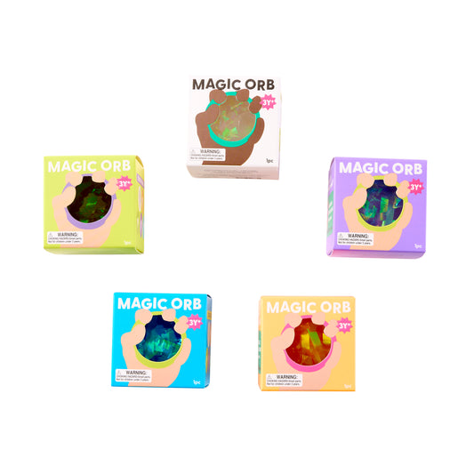 Assorted J'adore Magic Orb retail boxes showing colorful packaging for glitter sensory squeeze balls.