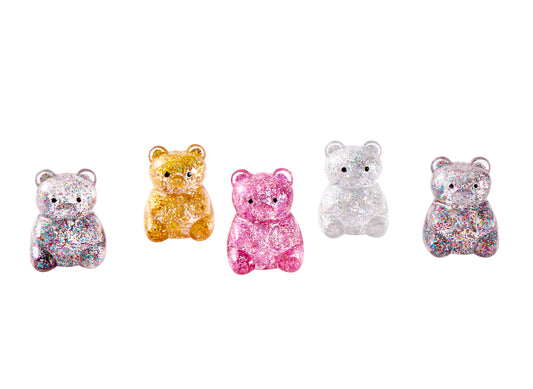 Five assorted J'adore Squeezy Bear glitter-filled squishy bears in different sparkling color combinations.