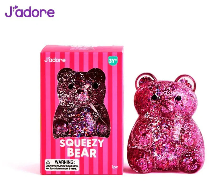 J'adore Squeezy Bear pink box next to the pink glitter bear squishy
