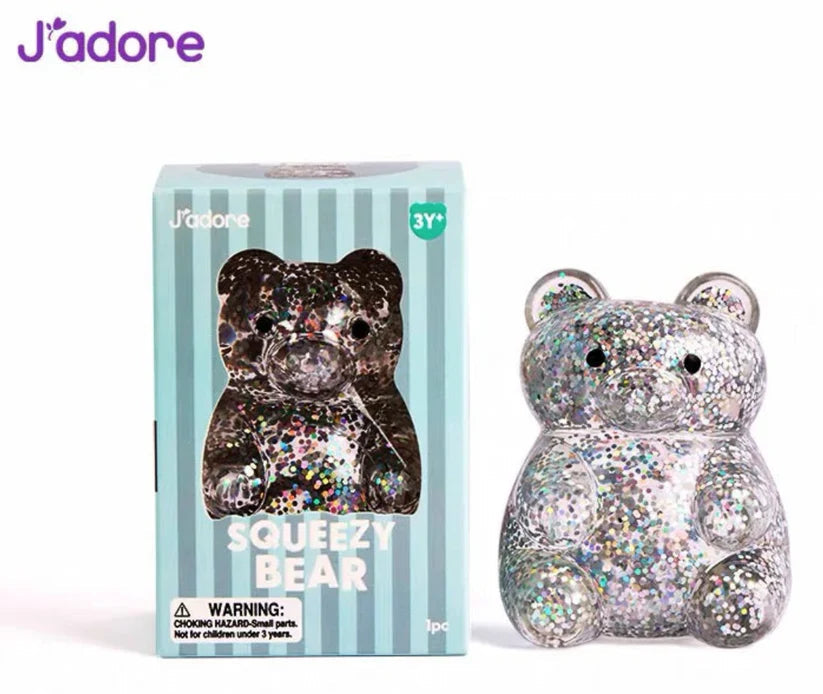 J'adore Squeezy Bear mint box next to the silver glitter bear squishy