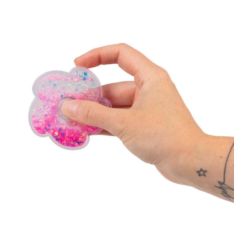 Hand holding the pink Liquid Glitter Fidget Spinner