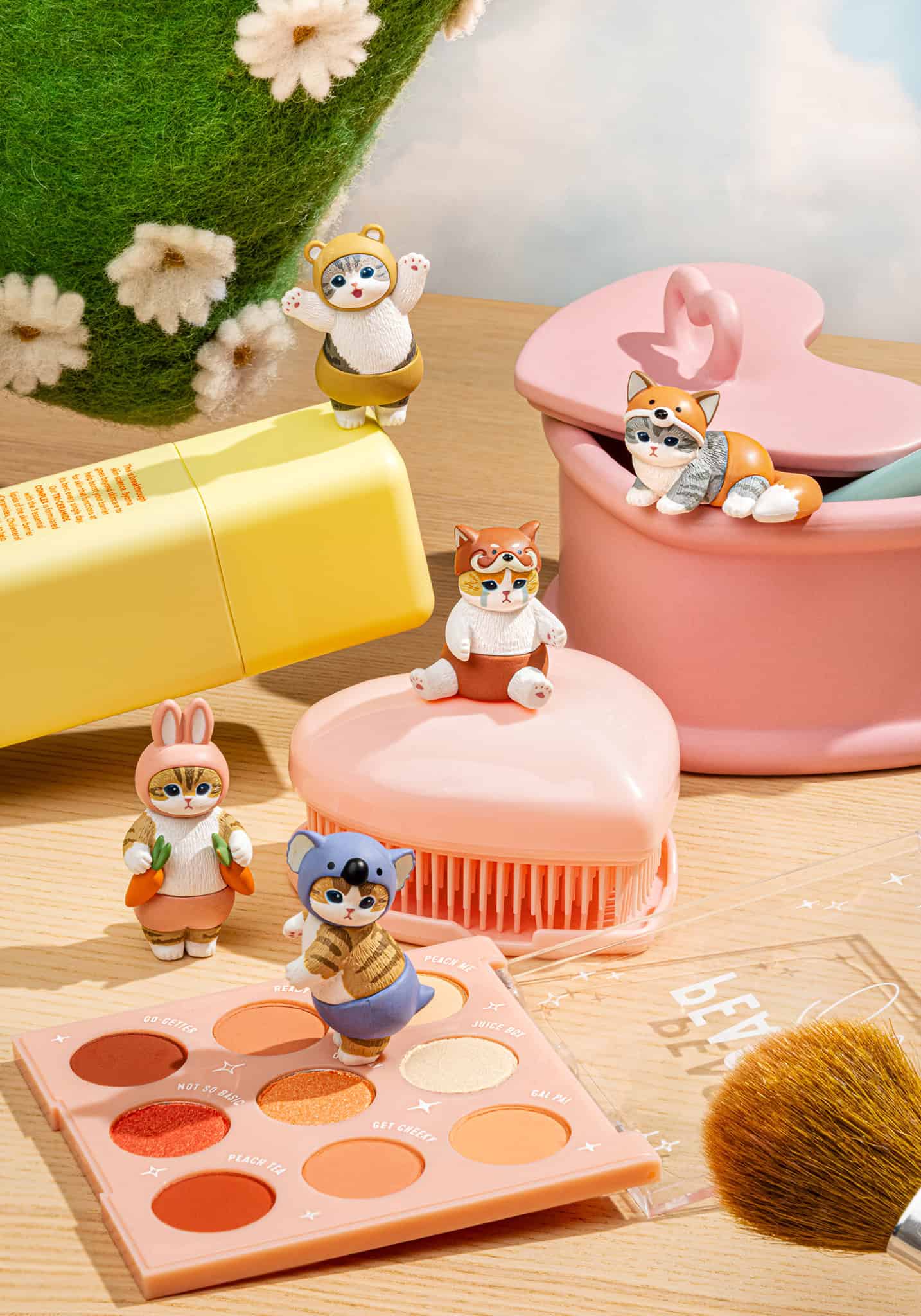 mofusand Meow Pants blind box cat figures displayed on a cute pastel desk