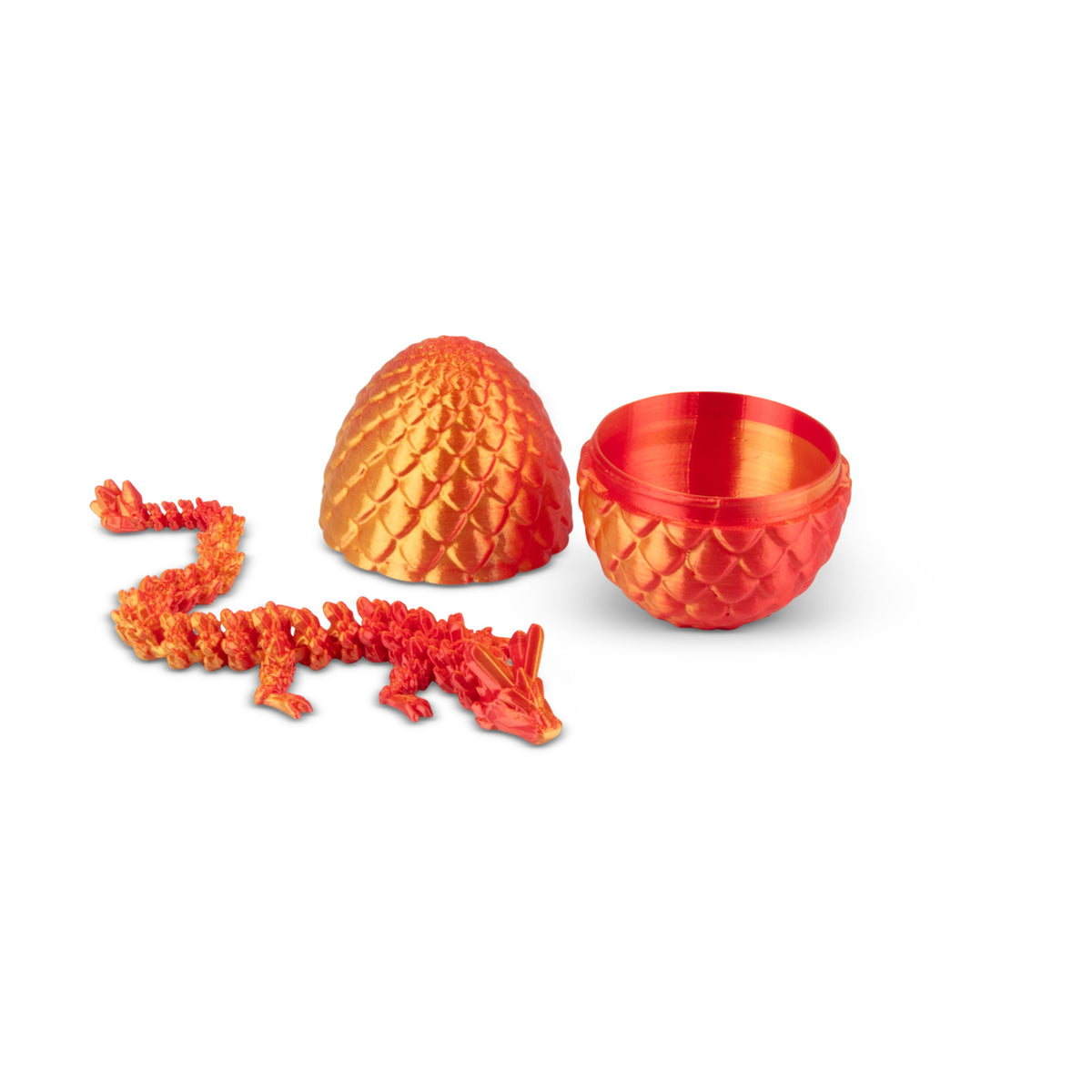 Open orange 3D printed dragon egg with articulated orange dragon figure beside it