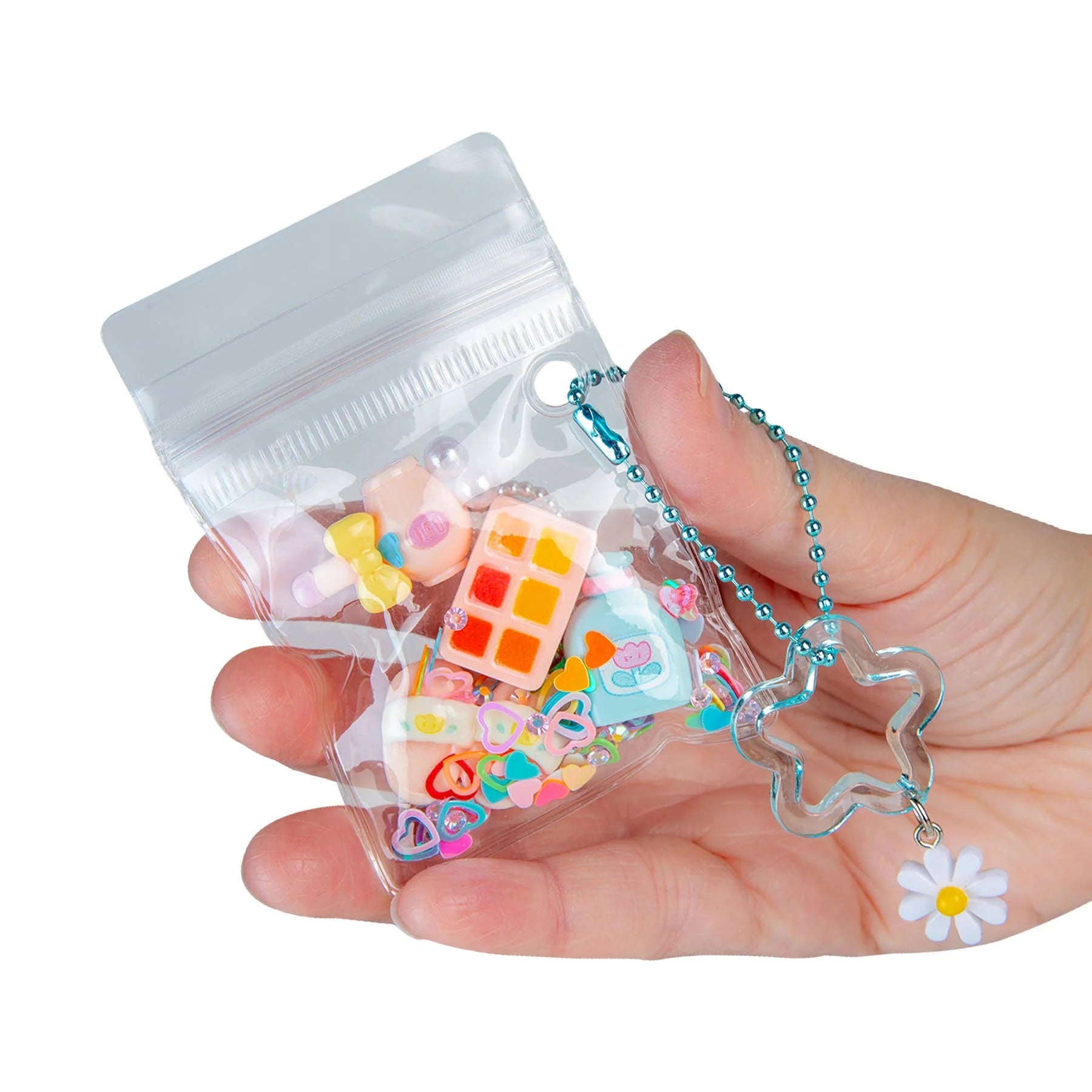 ORB Mini Gacha Glimmers Makeover mystery pouch filled with miniature beauty-inspired collectible accessories and keychain.