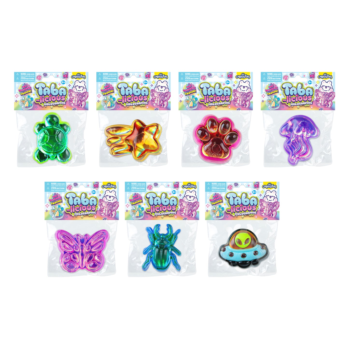 Packaged Taba-licious Holographic Series 2 assortment showing assorted collectible squishy toy designs.