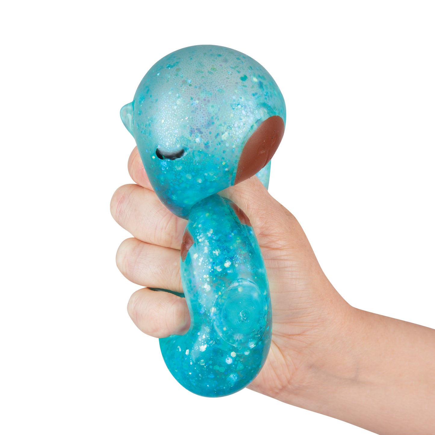 Side view of blue glitter Sparklee Capybara squishy toy held in hand.