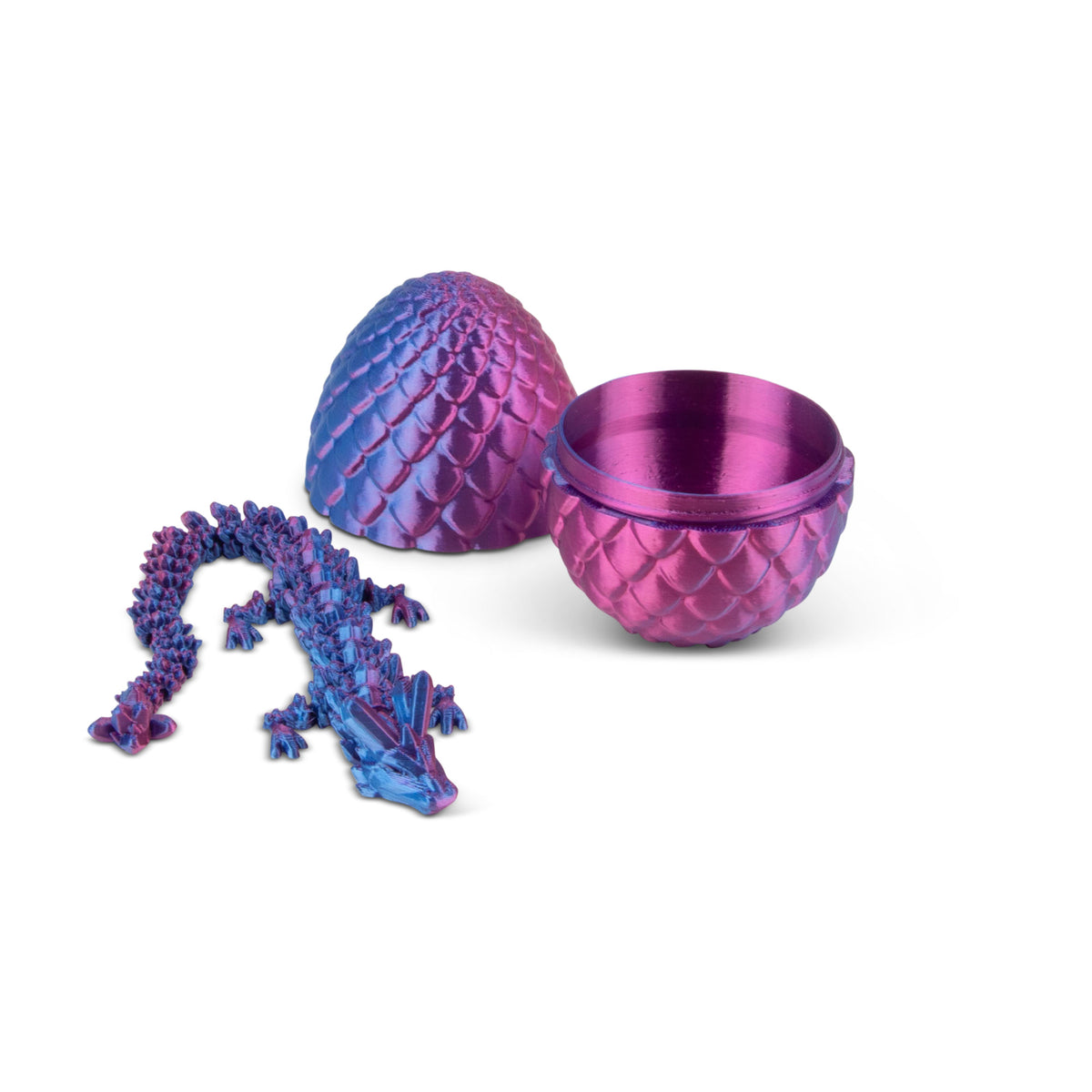 Open purple and pink 3D printed dragon egg with articulated purple-blue dragon figure