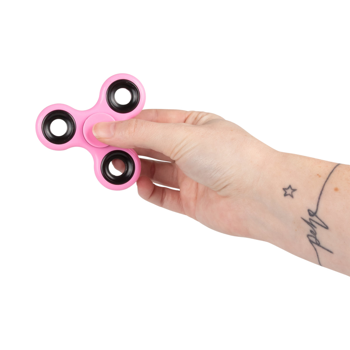 Hand holding a pink fidget spinner from the Sensory Surprise mystery bag