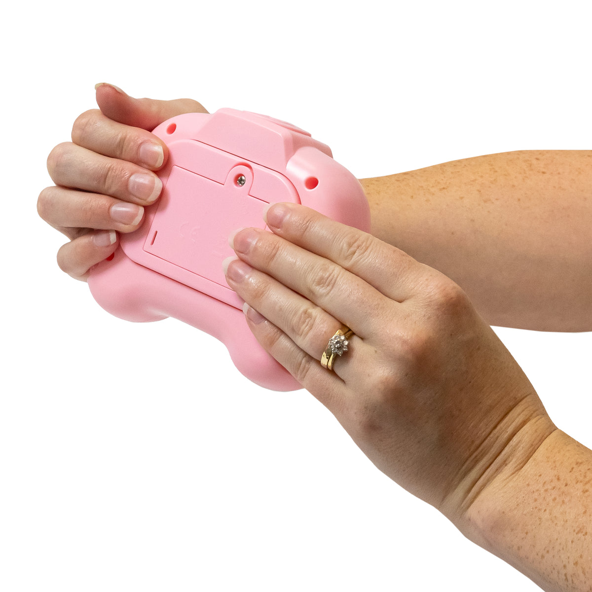 Hands playing the blue Time Pop light up push poppers game